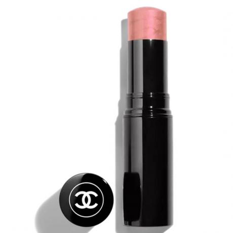 Chanel Baume Essentiel Glow Stick noir twist-up stick de fard à joues rose avec capuchon sur le côté sur fond blanc