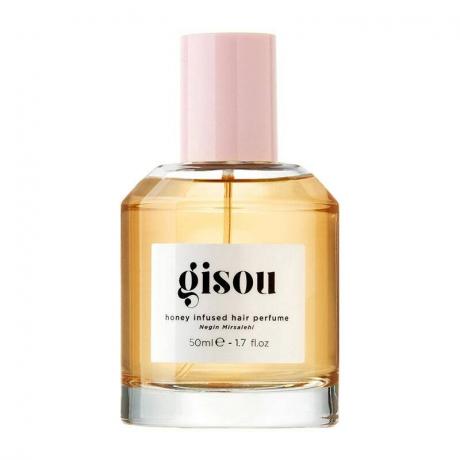 En flaska för Gisou Mini Honey Infused Hair Parfym på vit bakgrund