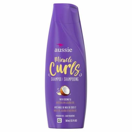 sticla violet de Aussie Miracle Curls pe un fundal alb