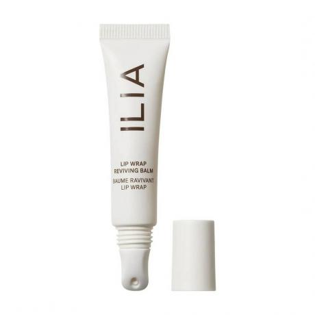 Ilia Lip Wrap Reviving Balm tub alb cu capac in lateral pe fundal alb