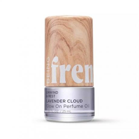 Menjadi Frenshe Glow On Roll-On Fragrance dalam perak Lavender Cloud dan wadah cetakan kayu dengan latar belakang putih