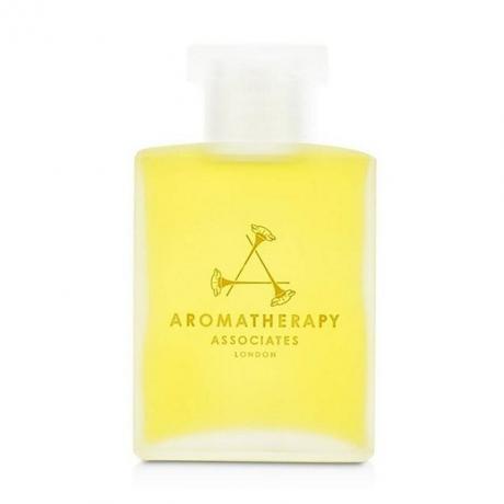 Aromatherapy Associates Support Equilibrium Bath and Shower Oil, ruudukujuline pudel kollast vanniõli valgel taustal
