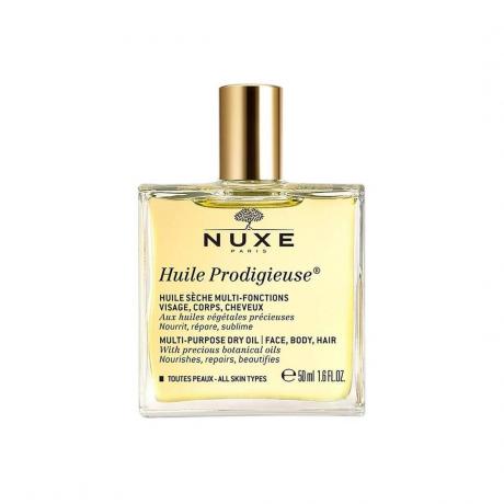 Ξηρό λάδι πολλαπλών χρήσεων Nuxe σε διαφανές τετράγωνο μπουκάλι με χρυσό καπάκι σε λευκό φόντο