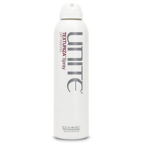 Unite Hair Texturiza Spray recipient cu spray alb pe fundal alb