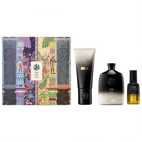 Čiernobiele produkty starostlivosti o vlasy s gradientom Oribe Gold Lust Collection a vzorovaná krabička na bielom pozadí