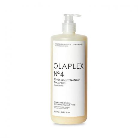 Balta pudele Olaplex No.4 Bond Maintenance Shampoo uz balta fona.