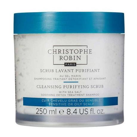 Christophe Robin Cleansing Purifying Scrub med havssalt genomskinlig burk med hårbottensalt scrub med blått lock på vit bakgrund