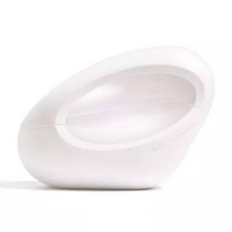 MOD by Ariana Grande bela asimetrična steklenička parfuma v obliki jajca na belem ozadju