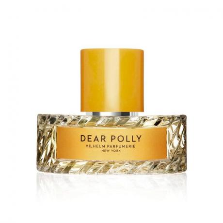 Ένα χρυσό μπουκάλι αρώματος του Vilhelm Parfumerie Dear Polly Eau de Parfum σε λευκό φόντο