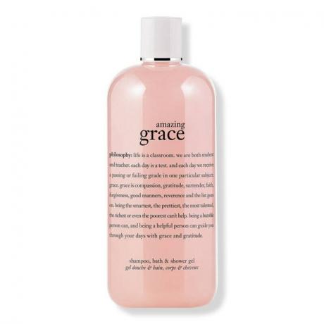 Steklenička rožnatega parfumiranega šampona, gela za prhanje in peneče kopeli Philosophy Amazing Grace na belem ozadju