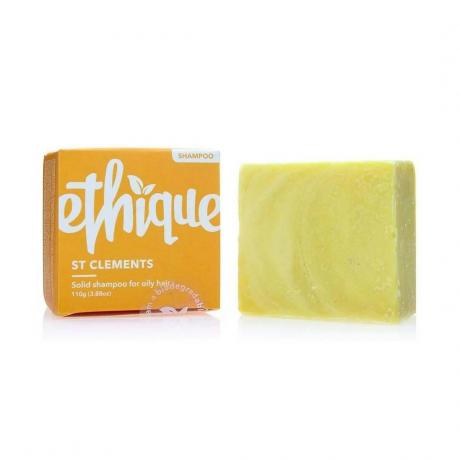 Ethique Shampoo Bar per capelli grassi Shampoo bar giallo con scatola arancione su sfondo bianco