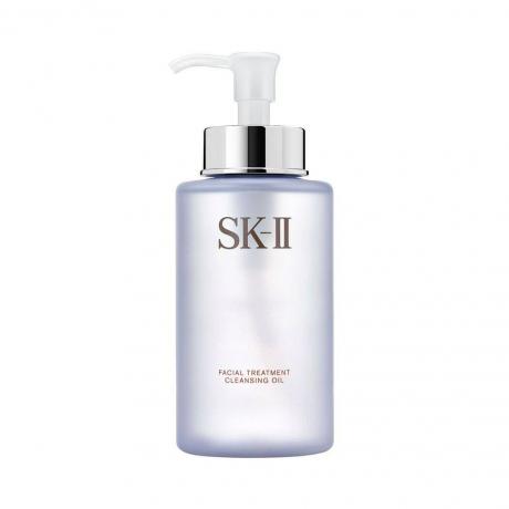 SK-II Tratamiento Facial Aceite Limpiador azul translúcido botella de aceite limpiador con bomba blanca sobre fondo blanco