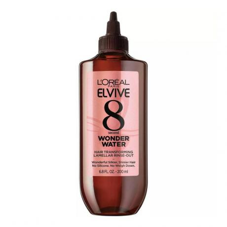 L'Oréal Paris Elvive 8 Second Wonder Vannbrun flaske med skinnende rosa etikett og spiss hette på hvit bakgrunn