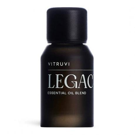 Vitruvi Legacy Essential Oil Blend botol coklat gelap mini dengan latar belakang putih