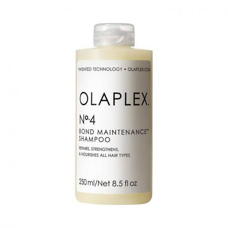 Olaplex No. 4 Bond Maintenance Shampoo: caurspīdīga šampūna pudele ar baltu etiķeti un melnu tekstu uz balta fona