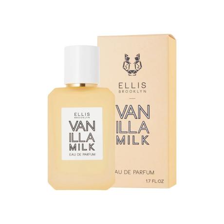 Vanilla Milk Eau de Parfum dzeltena smaržu pudele ar dzeltenu kastīti uz balta fona