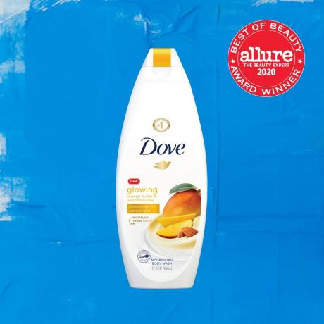 en flaska Dove Glowing Mango Butter & Almond Butter Body Wash på blå bakgrund