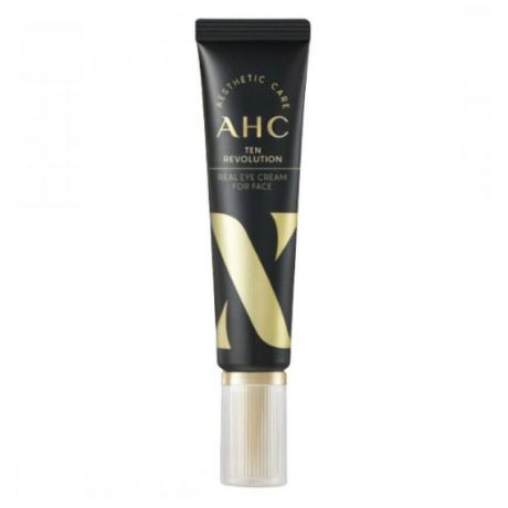 Μαύρο σωληνάριο AHC Ten Revolution Real Eye Cream For Face με χρυσό τύπο σε λευκό φόντο