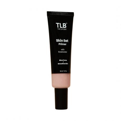 Un tube noir de The Lip Bar Skin Set Primer sur fond blanc