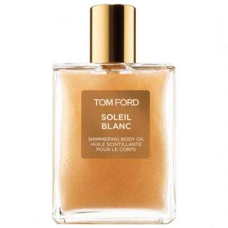 Obdĺžniková fľaštička zlatého telového oleja Tom Ford Soleil Blanc trblietavého telového oleja so zlatým uzáverom na bielom pozadí
