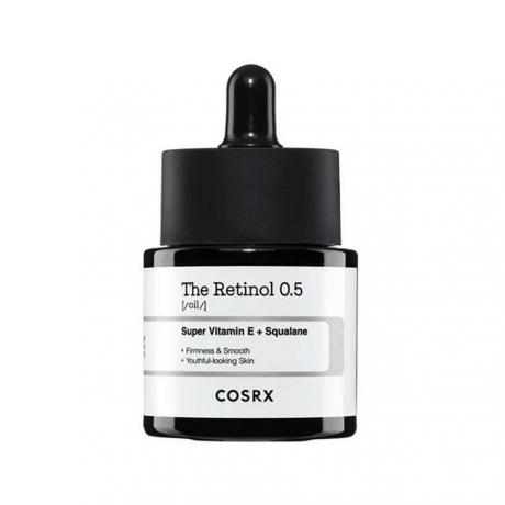 Cosrx The Retinol 0.5 Oil flacon de ser negru cu etichetă albă pe fundal alb