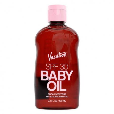Vacation SPF 30 Baby Oil gjennomsiktig rød flaske med rosa kork på hvit bakgrunn
