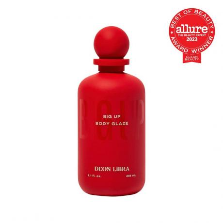 Deon Libra Big Up Body Glaze בקבוק אדום עם פקק כדור אדום על רקע לבן עם חותם Allure BoB אדום בפינה הימנית העליונה