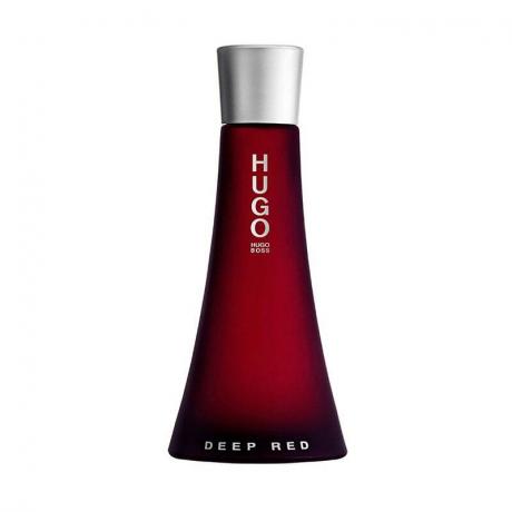 En röd, smal parfymflaska av Hugo Boss Deep Red Eau de Parfum på en vit bakgrund