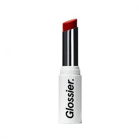 Tube de rouge à lèvres Glossier Generation G en rouge sur fond blanc