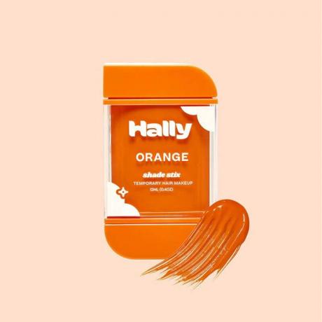 Oranžová tyčinka na mejkap na vlasy Hally Hair Shade Stix na svetlo oranžovom pozadí
