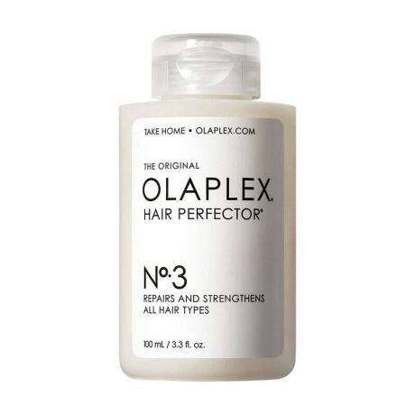 Olaplex No. 3 Hair Perfector: Ένα διαφανές μπουκάλι με λευκή ετικέτα και μαύρο κείμενο σε λευκό φόντο