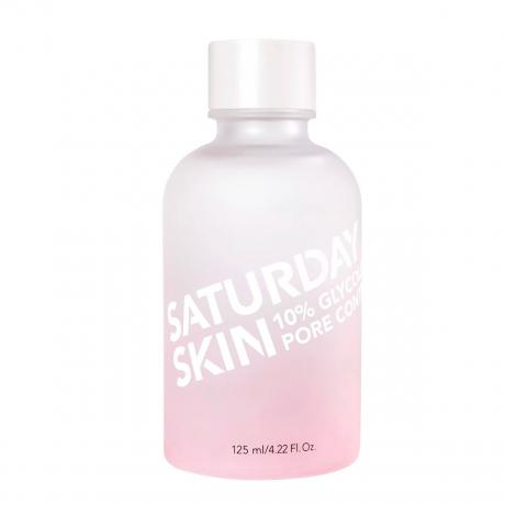 Uma garrafa rosa e branca de toner em um fundo branco