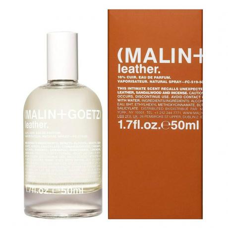 Steklenička kolonjske vode Malin + Goetz Leather Eau de Parfum z oranžno škatlo na belem ozadju