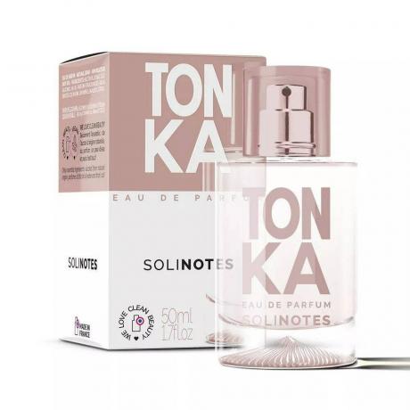 Solinotes Γυναικείο άρωμα Tonka μπουκάλι αρώματος με μωβ κείμενο και μωβ και λευκό κουτί σε λευκό φόντο