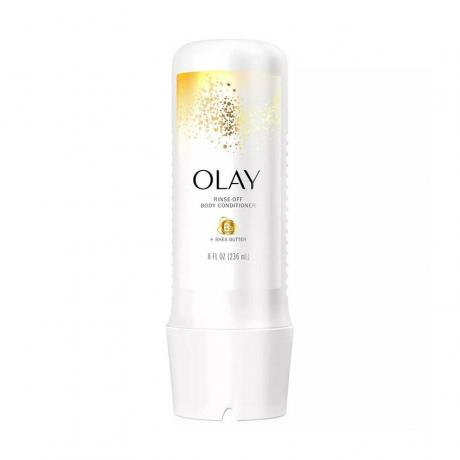 Olay Rinse-Off Body Conditioner baltas išspaudžiamas buteliukas su auksiniu konfeti dizainu baltame fone