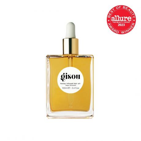 Gisou Honey Infused Hair Oil διαφανές τετράγωνο μπουκάλι χρυσού λαδιού μαλλιών με χρυσό και λευκό σταγονόμετρο σε λευκό φόντο με κόκκινη σφραγίδα Allure BoB στην επάνω δεξιά γωνία