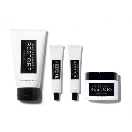 Doctor Rogers Restore Post Procedure Kit (contenants noirs et blancs de nettoyant pour le visage, de crème pour le visage et de deux baumes de guérison) sur fond blanc