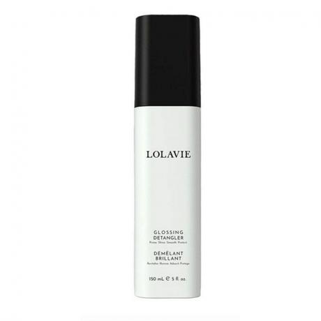 Un flacone spray bianco e nero del LolaVie Glossing Detangler su sfondo bianco