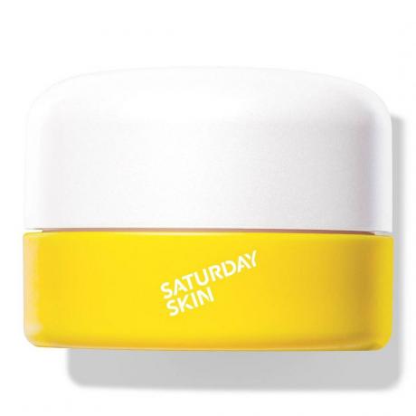 Saturday Skin Yuzu Vitamine C Bright Eye Cream pot jaune avec couvercle blanc sur fond blanc