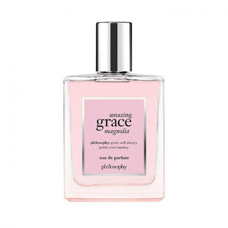 Una bottiglia rosa di Philosophy Amazing Grace Magnolia Eau de Parfum su sfondo bianco