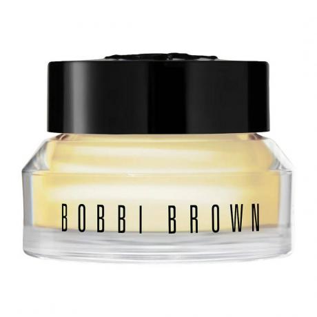 Bobbi Brown Cremă pentru ochi îmbogățită cu vitamine Borcan de cremă galbenă pentru ochi cu capac negru pe fundal alb