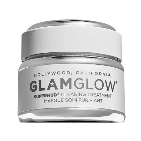 Een witte en grijze pot GlamGlow Supermud Charcoal Instant Treatment Mask op een witte achtergrond