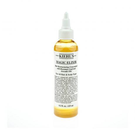 Žlutá lahvička Kiehl's Magic Elixir s bílým štítkem na bílém pozadí